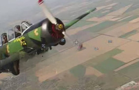 A gunman with a shotgun shoots down Russian drones from a Ukrainian Yak-52 airplane - a close look from the sky
