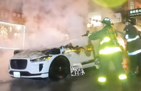 A crowd crashed and set fire to a Waymo unmanned cab in San Francisco. No one was in the car