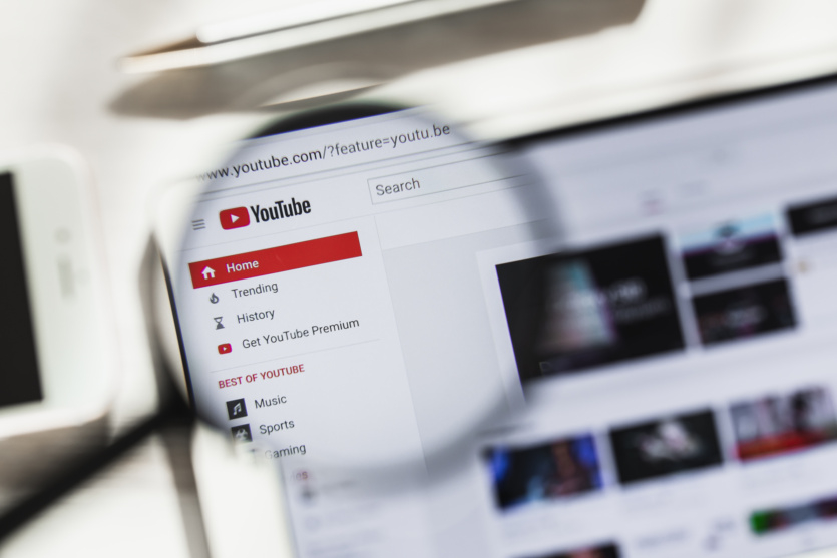 YouTube is testing experimental features: video search with Google Lens, channel QR codes, and AI chat summaries